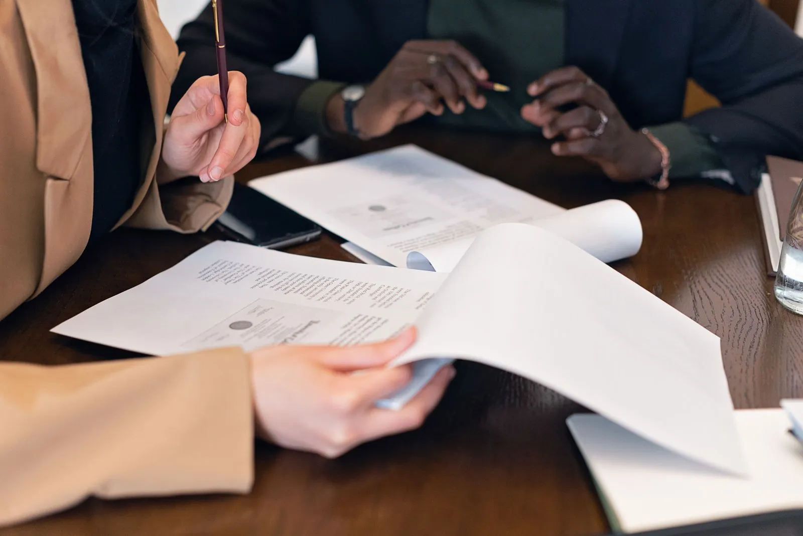 Financial documents being reviewed during an advisory meeting