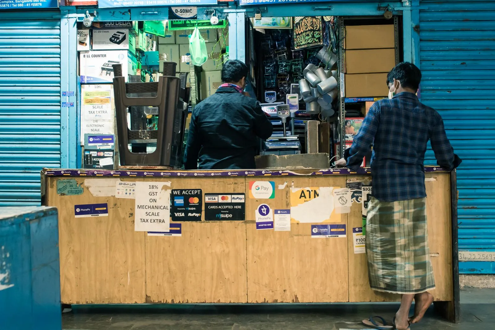 People at a small business counter in Bengaluru